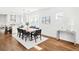 Bright dining area featuring hardwood floors, modern decor, and an open flow to the kitchen at 3884 Osceola St, Denver, CO 80212