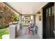Charming front porch with seating area, decorative rug, and clear view of the street at 3884 Osceola St, Denver, CO 80212