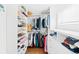 Organized walk-in closet with custom shelving and storage for shoes, clothes, and accessories at 3884 Osceola St, Denver, CO 80212