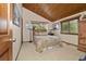 Bedroom with wood ceiling, comfortable bed and natural light from the windows at 4407 Delaware Dr, Larkspur, CO 80118