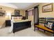 Inviting bedroom featuring dark wood furniture, a teddy bear on the bed and natural light from the window at 4407 Delaware Dr, Larkspur, CO 80118