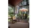 Relaxing outdoor deck with comfortable seating and scenic views of the surrounding forest at 4407 Delaware Dr, Larkspur, CO 80118