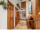 Welcoming entryway featuring wood accents, tile floors, and a view of the staircase at 4407 Delaware Dr, Larkspur, CO 80118