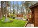 Charming front yard showcasing a well-maintained lawn and a quaint wooden shed at 4407 Delaware Dr, Larkspur, CO 80118