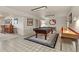 Spacious game room with a pool table, shuffleboard, and bar area perfect for entertaining guests at 4407 Delaware Dr, Larkspur, CO 80118