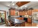 Well-designed kitchen with granite countertops, wood cabinets and a breakfast bar at 4407 Delaware Dr, Larkspur, CO 80118