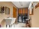 Convenient laundry room equipped with modern washer and dryer, ample cabinetry, sink and folding area at 4407 Delaware Dr, Larkspur, CO 80118