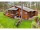 Beautiful wood home with an outdoor entertainment area and expansive grassy yard at 4407 Delaware Dr, Larkspur, CO 80118