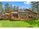 Stunning wood home featuring an expansive deck perfect for entertaining and relaxing outdoors at 4407 Delaware Dr, Larkspur, CO 80118