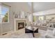 Living Room with fireplace and views into kitchen and dining area at 12135 S Meander Way, Parker, CO 80138