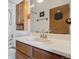 Bathroom features a traditional vanity, sink, mirror, toilet, and tub shower at 892 Summer Dr # 15B, Highlands Ranch, CO 80126