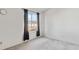 Bright bedroom with large window and neutral carpet for a cozy atmosphere at 892 Summer Dr # 15B, Highlands Ranch, CO 80126