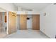 Bright bedroom featuring sliding closet doors, and neutral walls at 892 Summer Dr # 15B, Highlands Ranch, CO 80126