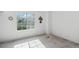 Empty bedroom featuring light walls, and a large window for natural light at 892 Summer Dr # 15B, Highlands Ranch, CO 80126