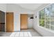 A bedroom with a closet and a large window offering plenty of natural light at 892 Summer Dr # 15B, Highlands Ranch, CO 80126