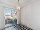 Dining area featuring black and white checkered floors with sliding glass doors to patio at 892 Summer Dr # 15B, Highlands Ranch, CO 80126