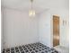 Dining room featuring a door and tile flooring at 892 Summer Dr # 15B, Highlands Ranch, CO 80126