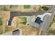 Overhead view of property's spacious layout with new driveway and backyard setup at 16197 Paris Way, Brighton, CO 80602