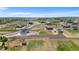 Scenic aerial view of homes in a sprawling community with views of a lake at 16197 Paris Way, Brighton, CO 80602