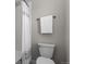Clean bathroom features white toilet, shower and towel rack at 16197 Paris Way, Brighton, CO 80602