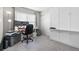 Home office features a built-in Murphy bed and a large window at 16197 Paris Way, Brighton, CO 80602