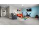 Bright bonus room featuring colorful decor and a TV, perfect for entertaining or relaxation at 16197 Paris Way, Brighton, CO 80602