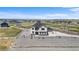 Expansive home with a well maintained lawn, long driveway and fenced perimeter at 16197 Paris Way, Brighton, CO 80602