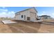 Detached garage with a roll-up door and side entry door for RV or boat storage at 16197 Paris Way, Brighton, CO 80602