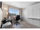 Functional home office with a modern desk setup and a Murphy bed for guests at 16197 Paris Way, Brighton, CO 80602