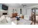 Cozy living room featuring a fireplace, neutral decor, and dark hardwood floors at 16197 Paris Way, Brighton, CO 80602