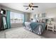 Bright bedroom featuring large windows, soft lighting, and serene decor for a peaceful retreat at 16197 Paris Way, Brighton, CO 80602