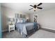 Cozy bedroom featuring a fan, plush bedding, and soft lighting create a relaxing retreat at 16197 Paris Way, Brighton, CO 80602
