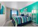 Inviting main bedroom features colorful bedding, abundant light, and a peaceful retreat at 16197 Paris Way, Brighton, CO 80602