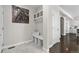 Hallway with a built-in bench, storage, and convenient access to a kitchen at 16197 Paris Way, Brighton, CO 80602