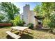 Home exterior showcasing a well maintained yard with a table for outdoor enjoyment at 978 S Salida St, Aurora, CO 80017