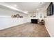Finished basement features a fireplace, decorative mirrors, and neutral carpeting at 978 S Salida St, Aurora, CO 80017