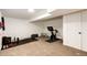 Unfinished basement features workout area with weights and fitness equipment at 978 S Salida St, Aurora, CO 80017