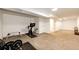Unfinished basement area with workout equipment and plenty of open space at 978 S Salida St, Aurora, CO 80017