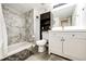 Updated bathroom with marble shower, modern vanity, and sleek fixtures at 978 S Salida St, Aurora, CO 80017
