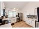 Modern kitchen featuring white cabinets, stainless steel appliances, and a bright, airy design at 978 S Salida St, Aurora, CO 80017