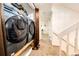 Convenient laundry area near stairs features modern washer and dryer at 978 S Salida St, Aurora, CO 80017