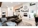 Open concept living room featuring a cozy fireplace, modern decor, and an inviting seating area at 978 S Salida St, Aurora, CO 80017