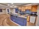 Finished basement wet bar with custom cabinetry, wine rack, black granite countertop, and a mini refrigerator at 10645 Clarkeville Way, Parker, CO 80134