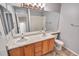 Bathroom features double sinks with vanity and a bath-shower combo at 10645 Clarkeville Way, Parker, CO 80134