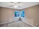 Neutral bedroom with carpet, ceiling fan and multiple windows at 10645 Clarkeville Way, Parker, CO 80134