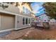 Rear elevation showing multiple windows, a wooden deck and an external pergola at 10645 Clarkeville Way, Parker, CO 80134