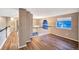 Hallway with hardwood floors and an architectural window at 10645 Clarkeville Way, Parker, CO 80134