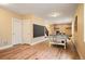 Finished basement with laminate floors, a ping pong table, and recreational space at 5050 Akron St, Denver, CO 80238