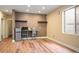 Basement kitchenette area with mini-fridge, sink, and ample counter space at 5050 Akron St, Denver, CO 80238