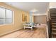 Spacious basement with wood floors, ping pong table, and natural light at 5050 Akron St, Denver, CO 80238